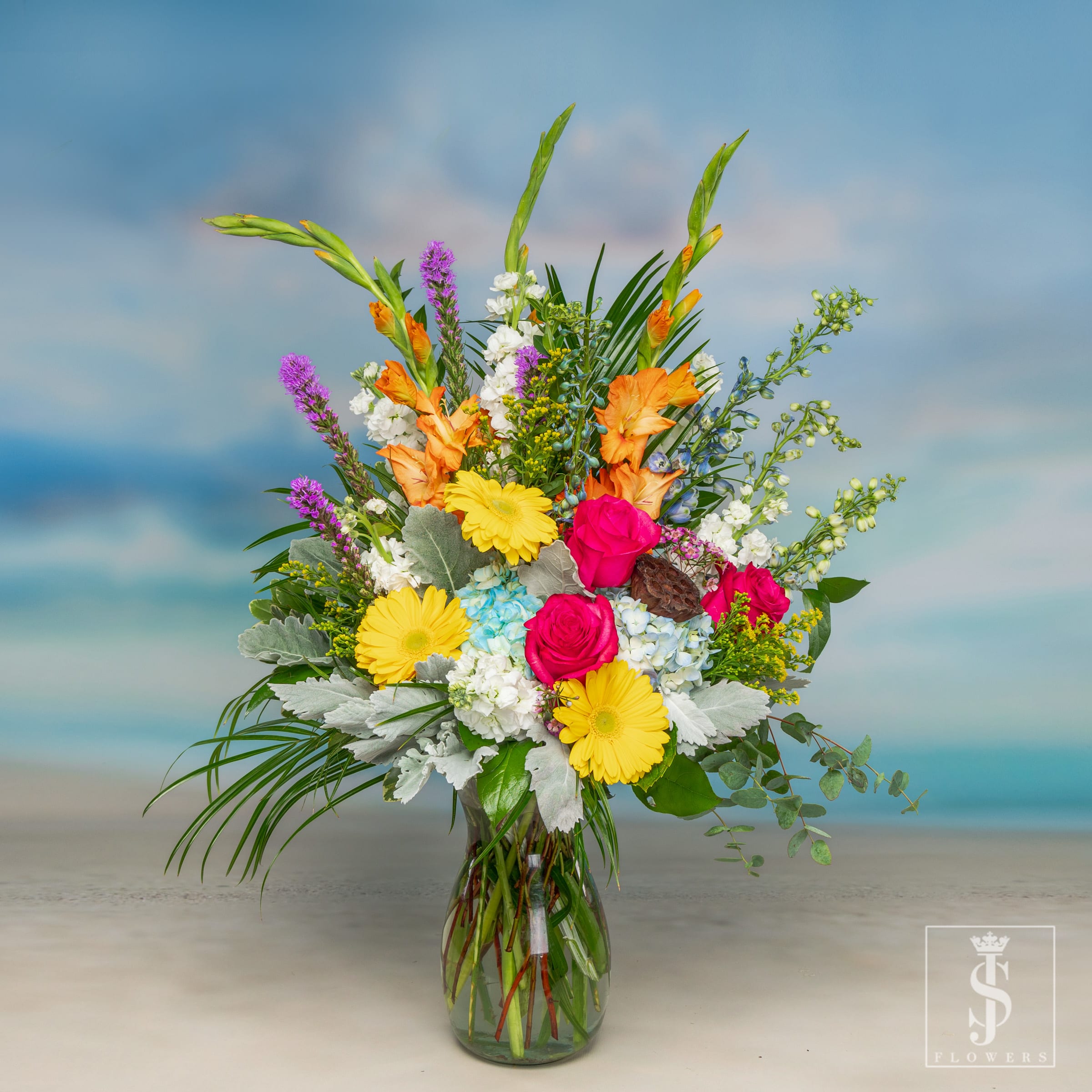 Designer's Choice Tall Summer Mix Special - Designer's Choice Tall Mixed Arrangement (Pictured at Premium)- Our wonderful team of Experienced Designers will put together a Classic Mixed Arrangement with you and your budget in mind. Whether you prefer something short and sassy or big-tall and showy we've got you covered. As your Dallas Best Florist we understand the Luxury of Sending Fresh Flowers along with your expectations. Your arrangement will be make fresh with love using all types of flowers varying based on the seasons. Let our designer's choose the freshest florals available to put together a custom vase arrangement for you.   Here at JS Flowers we pride ourselves with great customer service and we're always available to help answer any questions. Give us a call at (469)900-8095