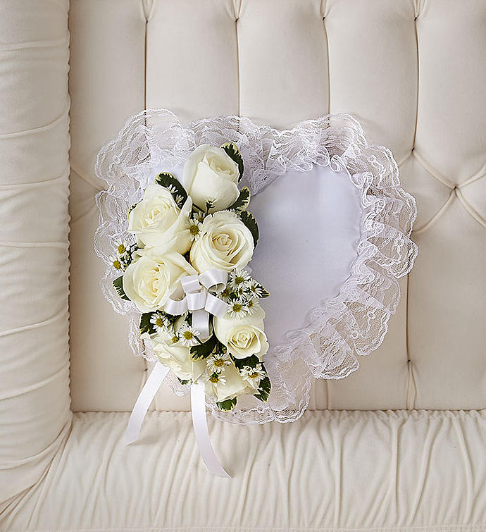 Heart-shaped lace bouquet with white roses and ribbon