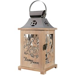Wooden lantern with floral cutouts and a metal top handle