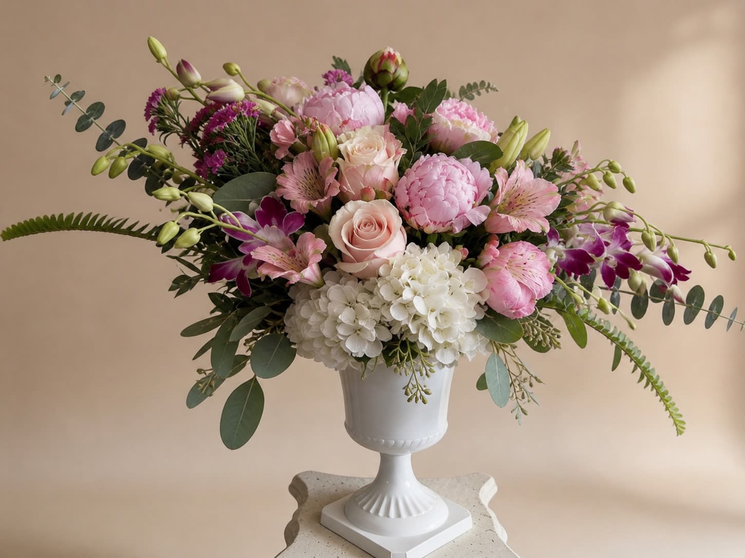 Paresse au Matin (Laziness under the morning light) - Eyes and hearts alike are drawn to this alluring and attractive arrangement full of fantasies, daydreams, and everything the color pink inspires. Take your recipient's breath away with this enticing pastel composition of blush pink roses, pink cymbidium orchids, elegant tulips, and white hydrangeas, surrounded by delicate dashes of greenery. The containers may vary depending on what is available, but guaranteed to be the same or higher than the original value  Since it is not longer Peony season the peonies in the picture will be replaced by flowers of the same value. Thank you for your understanding! 