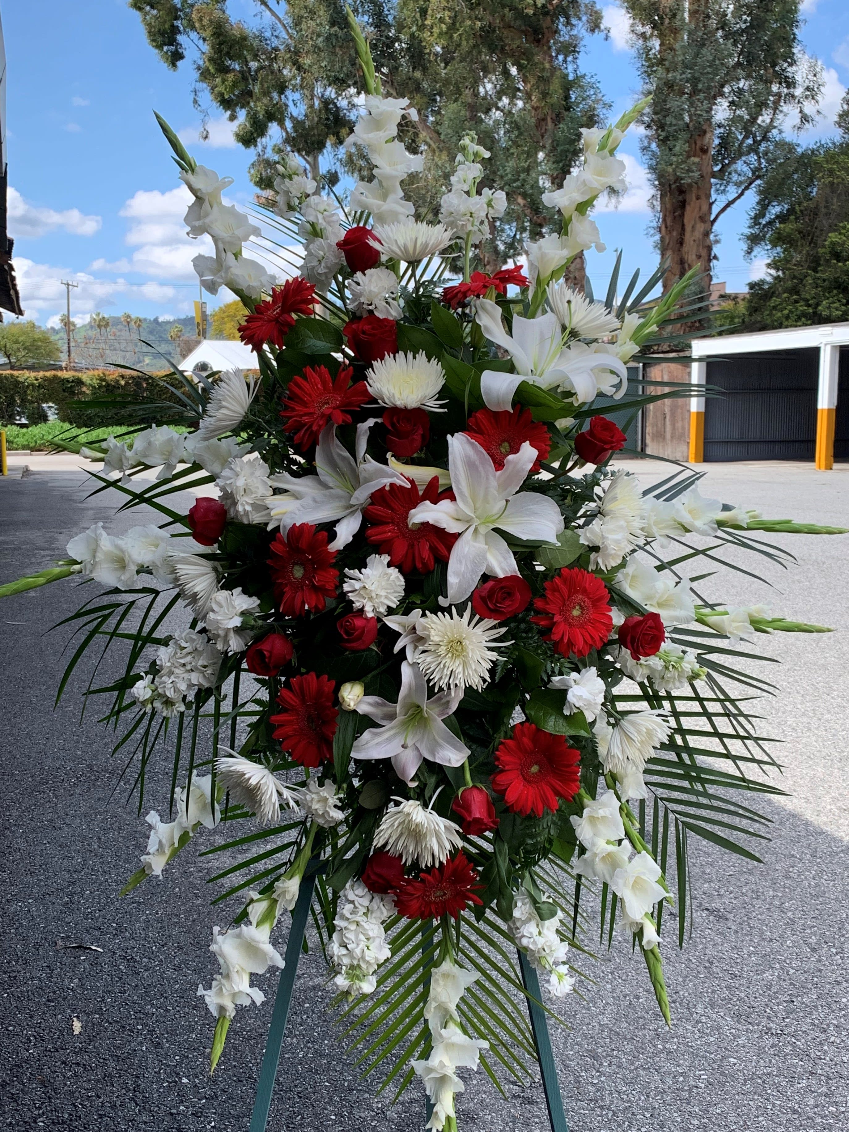 Tall standing floral spray with red and white flowers