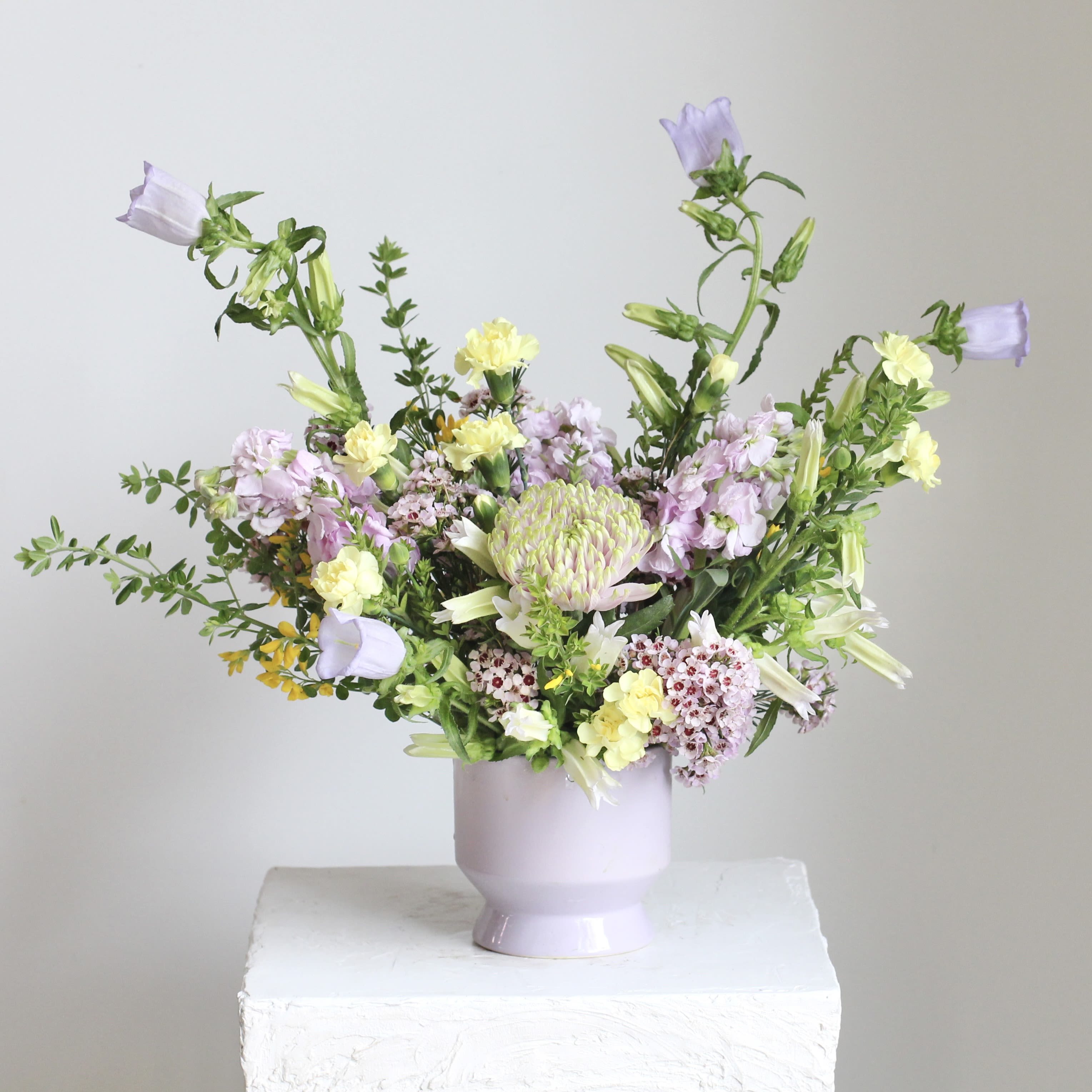 Lemon &amp; Lilac - Bright, cheerful, and full of seasonal charm, Lemon &amp; Lilac captures the essence of spring in bloom. Featuring sunny yellow and soft pastel purple blooms, it’s perfect for adding a touch of seasonal brightness to any space.  Delivery Policy: At Middlemist, we aim to make every delivery seamless and delightful. It is the sender’s responsibility to ensure the recipient is available to accept delivery between 3–5pm on the scheduled date and that the delivery address is accurate. We will send a text notification to the recipient on the day of delivery. If no one is available to receive the order, it will be returned to the shop and may be picked up or redelivered for an additional delivery fee. If a recipient requests the order be left unattended, we cannot guarantee the condition of the flowers or plants, and no refunds will be issued once an order is left outside.