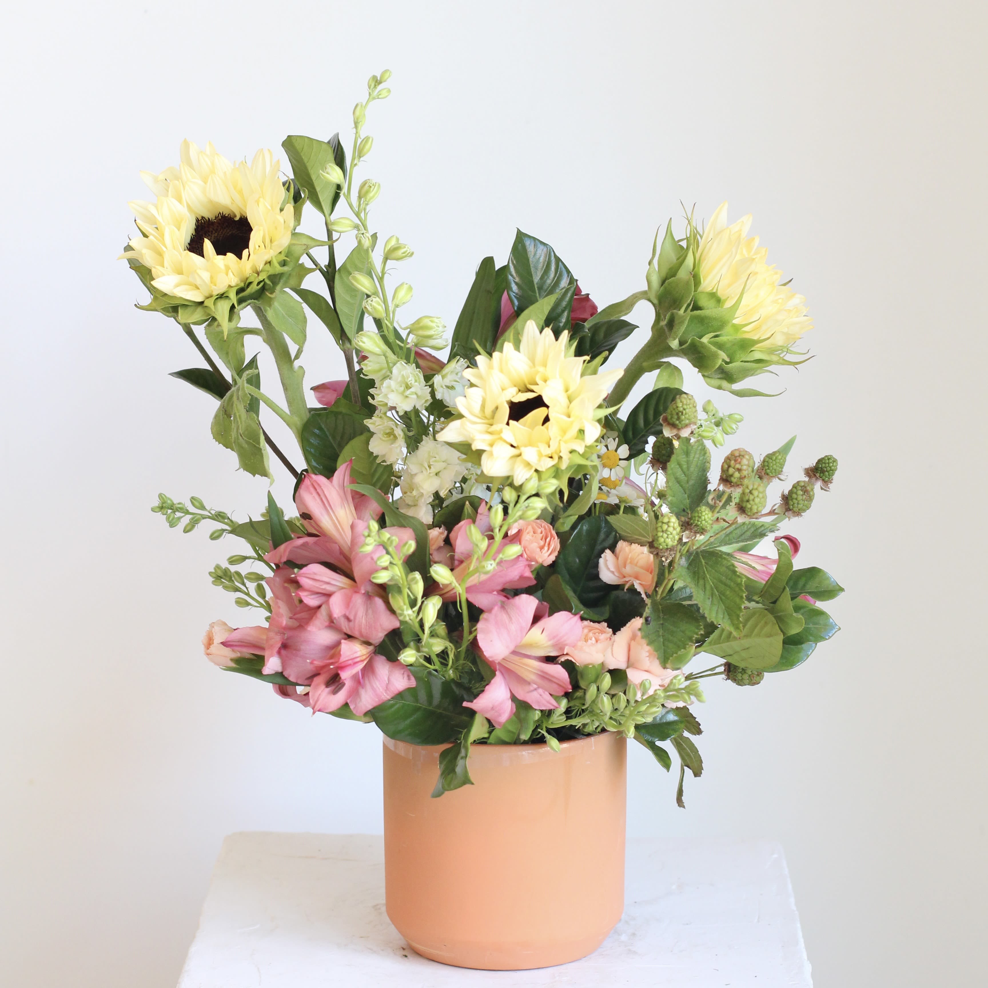 Sweet &amp; Sunny - Earthy yet refined, our "Sweet and Sunny" floral arrangement for a radiant burst of joy that's guaranteed to brighten anyone's day! This delightful arrangement is available in two sizes, with our standard option offering a charming, petite display that's both beautiful and budget friendly. Featuring cheerful sunflowers, it's like receiving a warm, sunny hug in floral form.  Delivery Policy: At Middlemist, we aim to make every delivery seamless and delightful. It is the sender’s responsibility to ensure the recipient is available to accept delivery between 3–5pm on the scheduled date and that the delivery address is accurate. We will send a text notification to the recipient on the day of delivery. If no one is available to receive the order, it will be returned to the shop and may be picked up or redelivered for an additional delivery fee. If a recipient requests the order be left unattended, we cannot guarantee the condition of the flowers or plants, and no refunds will be issued once an order is left outside.