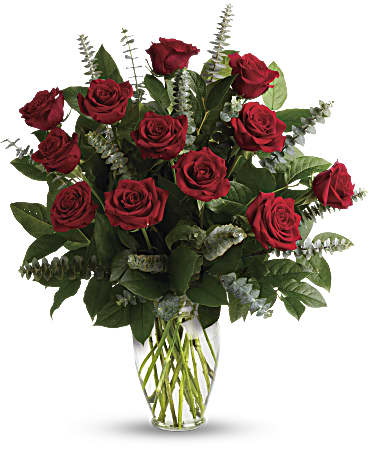 Bouquet of red roses in a clear glass vase