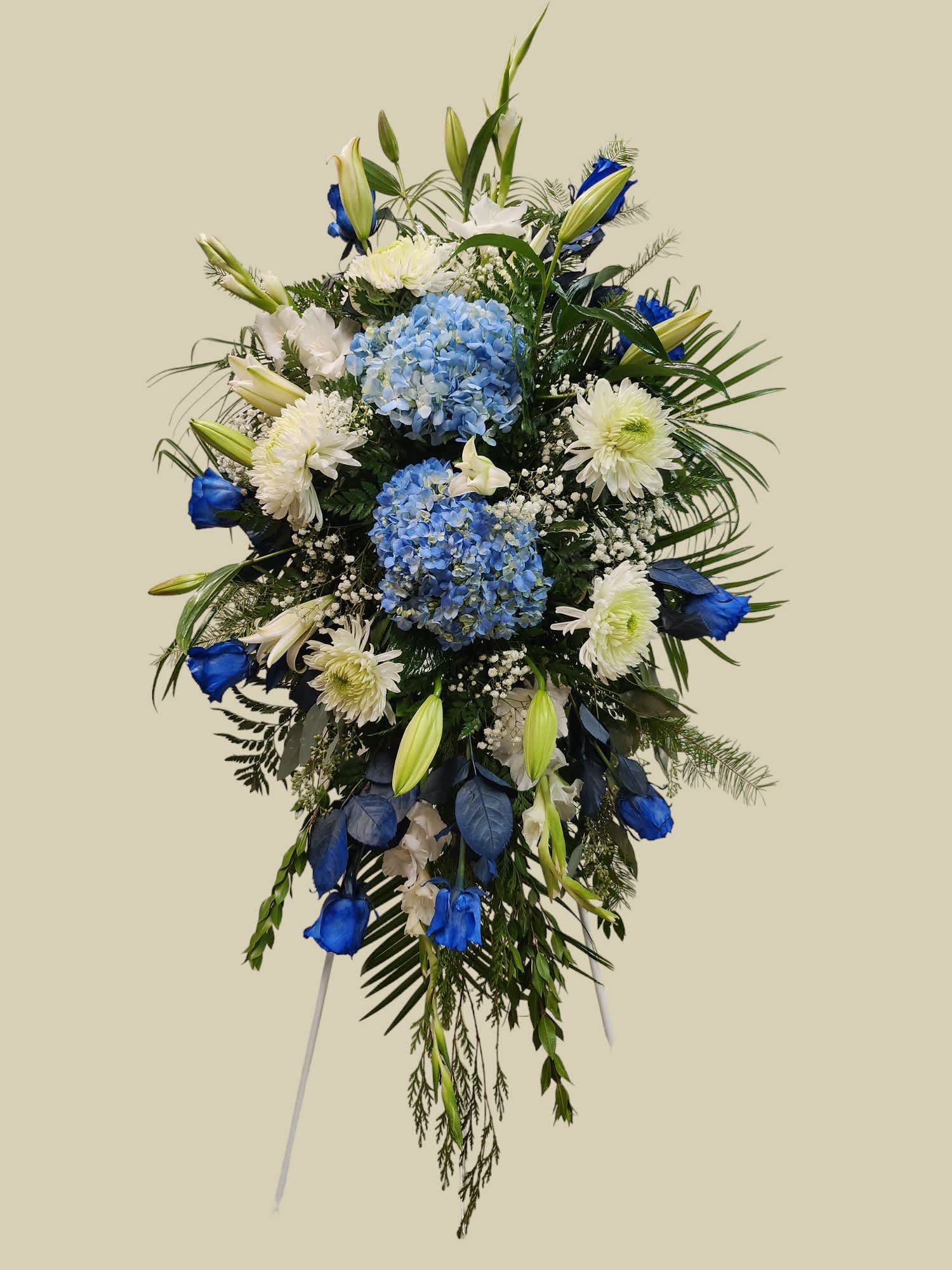 Blue and white floral standing spray with lilies and hydrangeas
