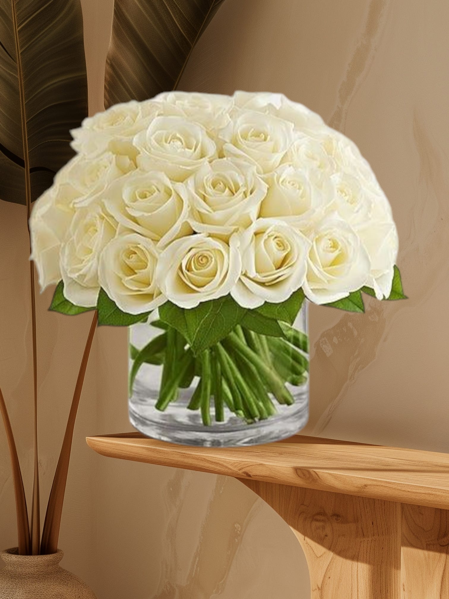 Bouquet of white roses in a clear glass vase