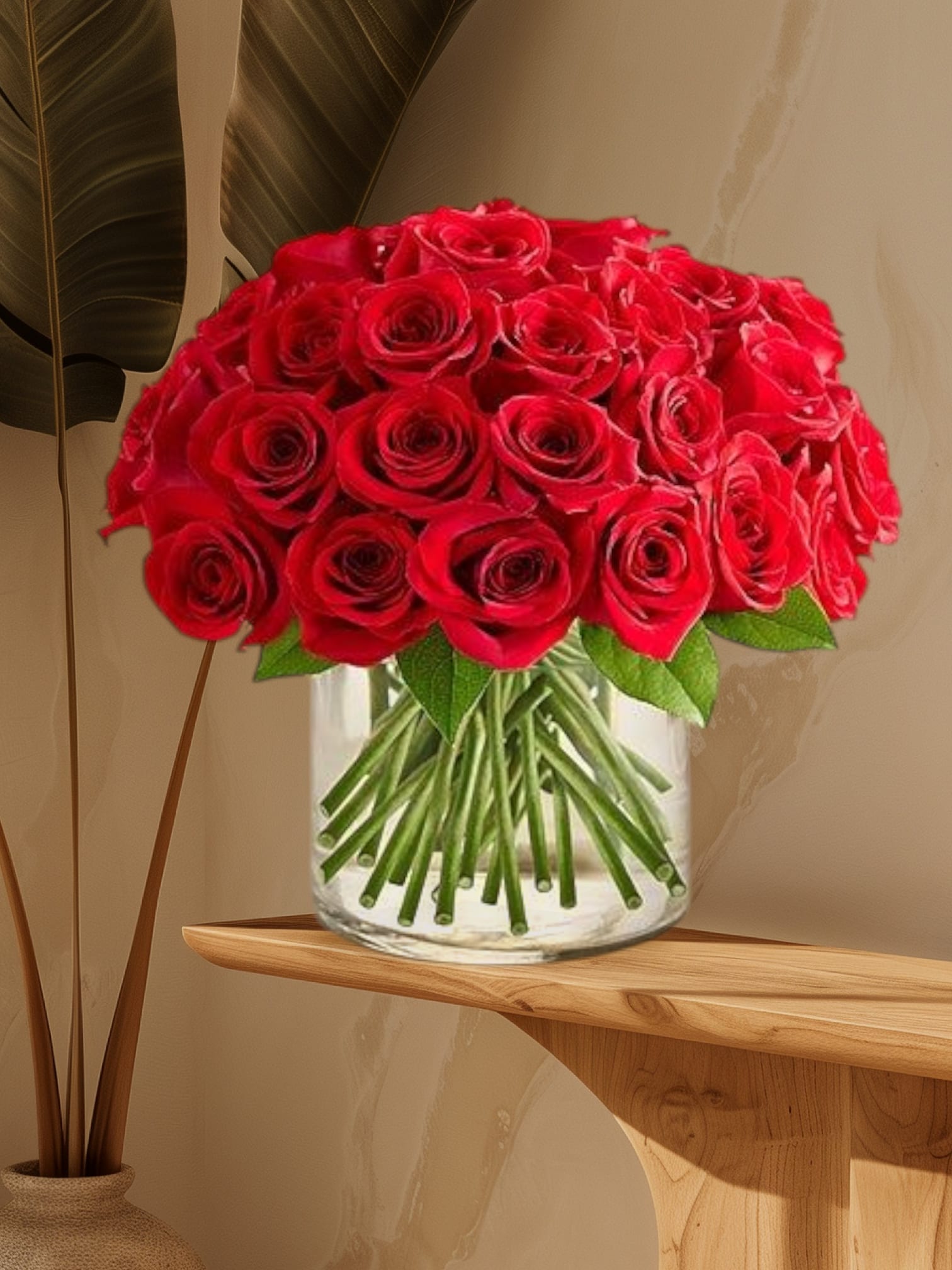 Bouquet of red roses in a clear glass vase