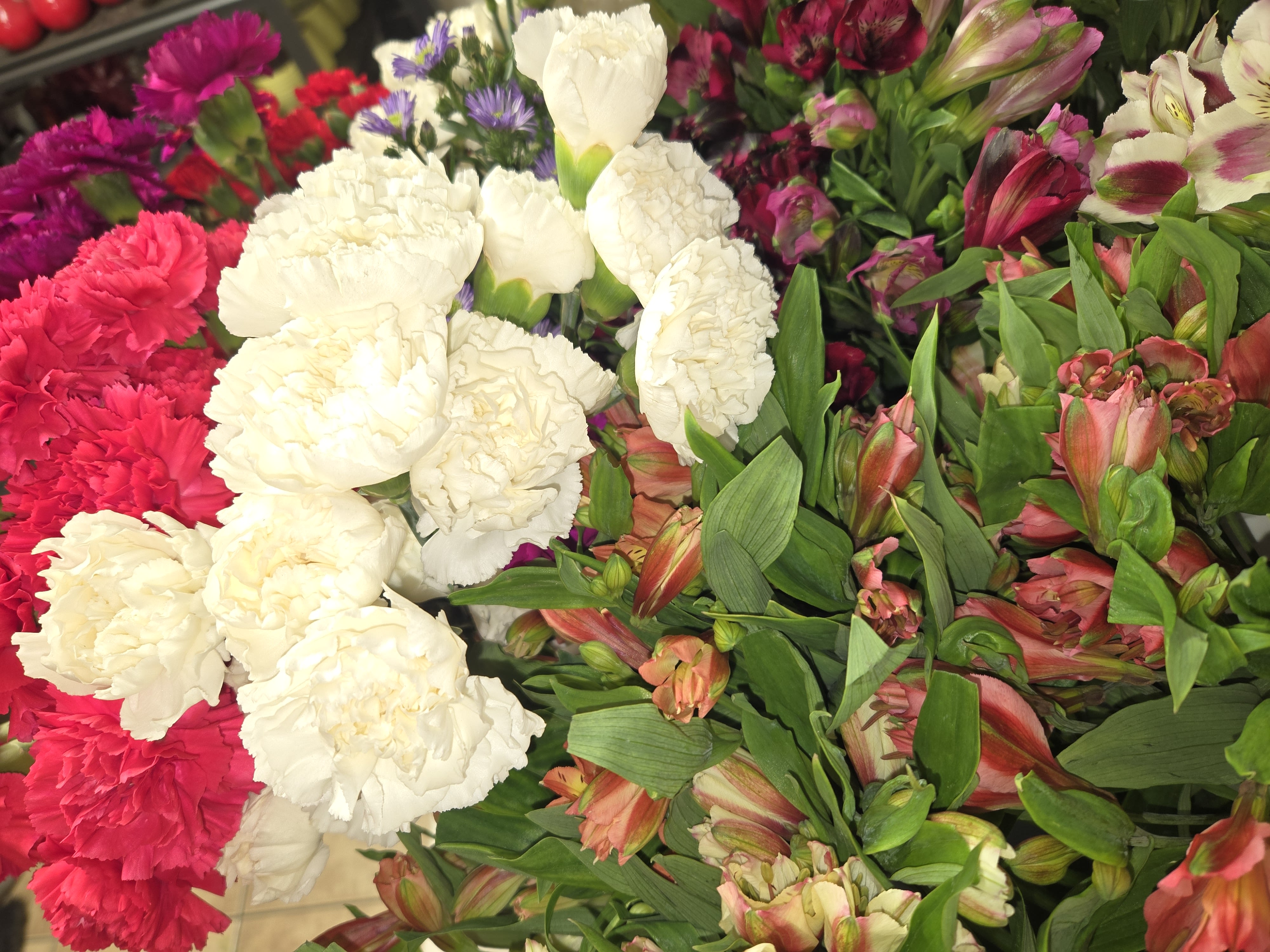 Mixed bouquet of white and pink carnations with pink alstroemeria