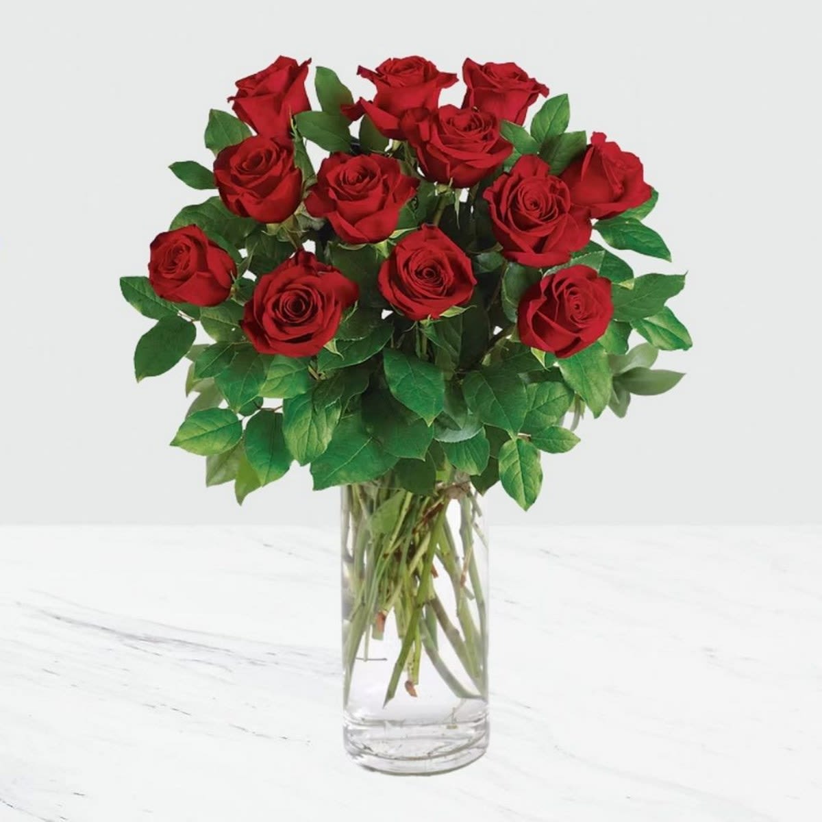 Bouquet of red roses in a clear glass vase