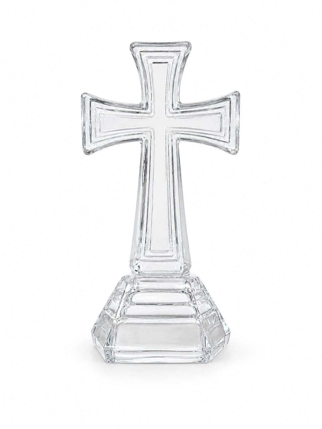 Clear glass cross-shaped decorative stand on a white background
