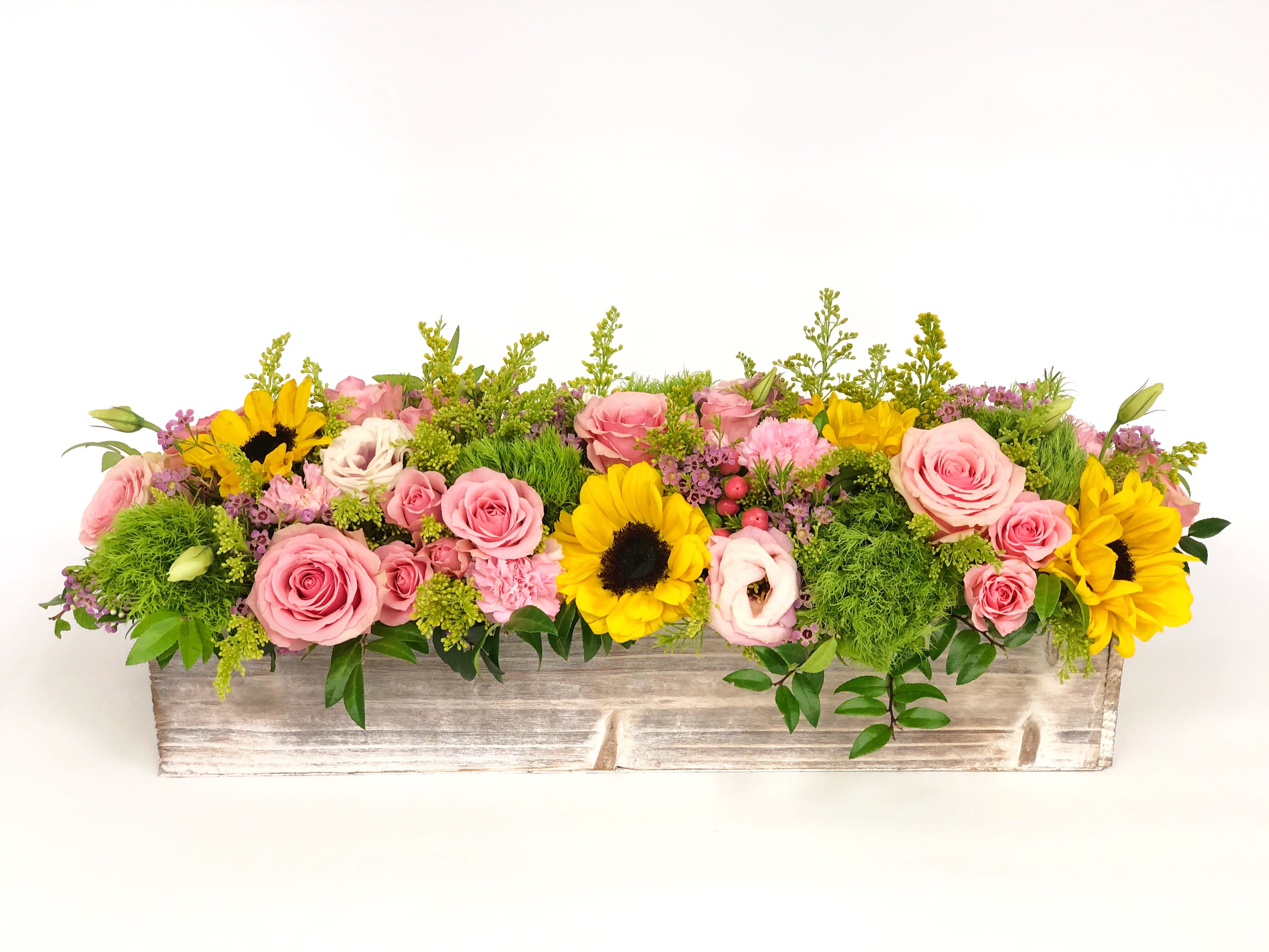 #30 - Long wood box arrangement Bright - If You want bouquet with a twist, choose our flower boxes. We have wood boxes for rustic looking arrangements, or hat boxes for a more elegant look. It’s a beautiful and convenient way. Flowers in boxes don’t need vases. That makes it perfect for transportation and keeping flowers hydrated and secure.
