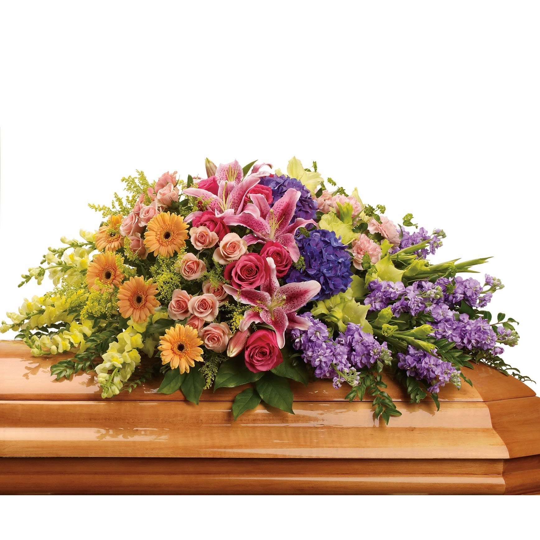 Colorful floral casket spray with lilies, roses, gerberas, and purple blooms