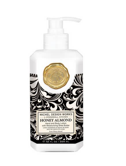 Bottle of honey almond hand and body lotion with a pump dispenser