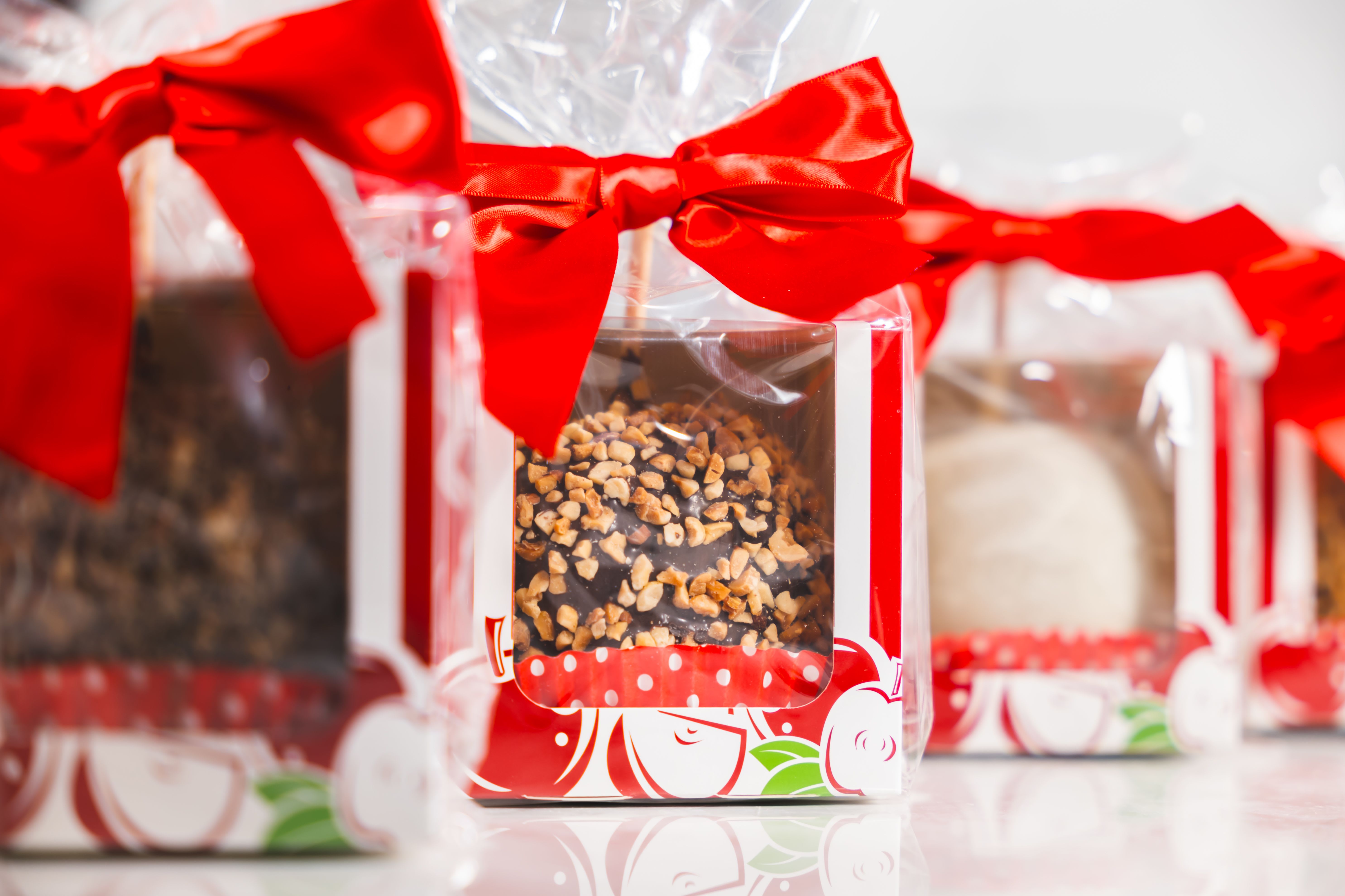 Wrapped chocolate gift boxes tied with red bows