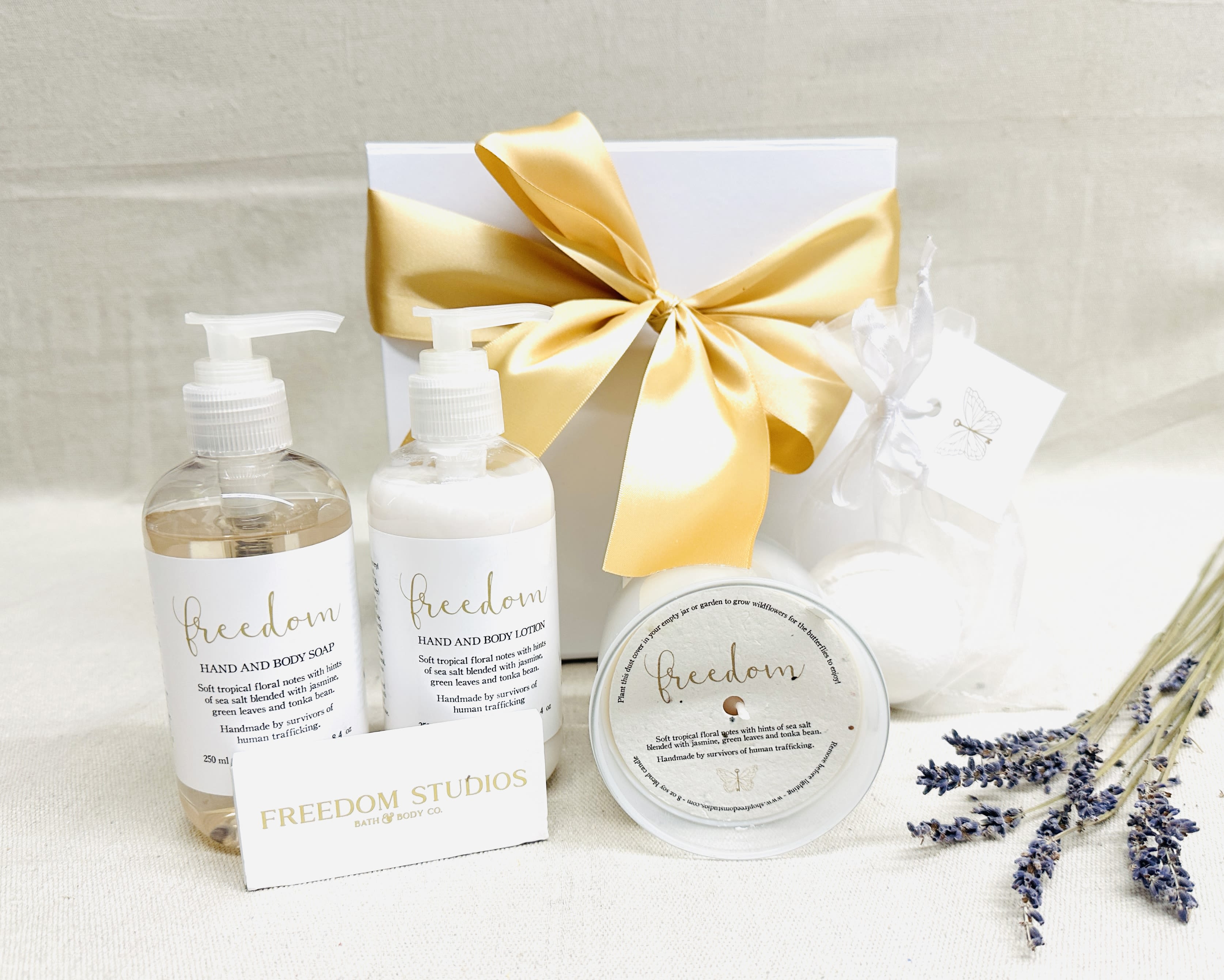 Gift set with soap, lotion, candle, and a ribbon-tied box