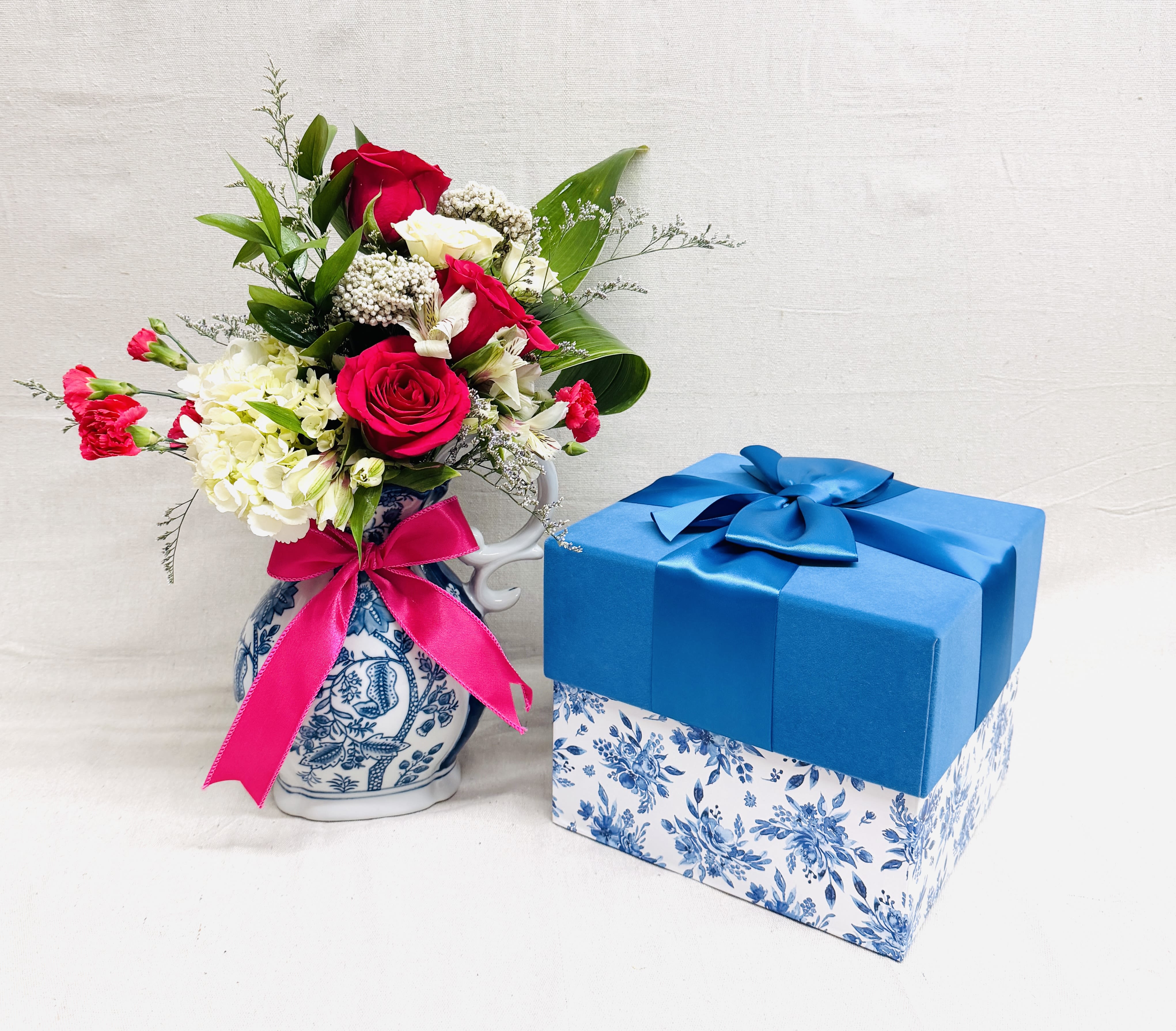 The Chinoiserie Pitcher and Gift Box - This stunning floral arrangement comes paired with a Sweet Wally Box.The Sweet Wally Box comes filled with all the best Sweet Wally Treats.  It starts with a Famous Apple Pie Caramel Apple, add an Apple Salsa or an Apple Butter, Roasted Pecan Butter Toffee, Chocolate Fudge made with Ghiradelli chocolate, an original Swurtle, a Rice Krispie WallyPop and Chocolate Oreos.