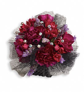 Bouquet of deep red and purple flowers with black mesh wrapping
