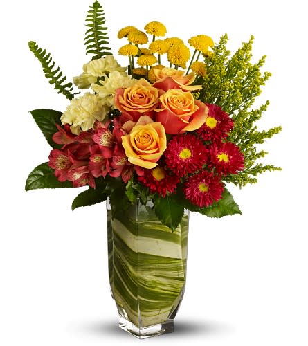Bouquet of orange roses, red mums, and cream carnations in a glass vase