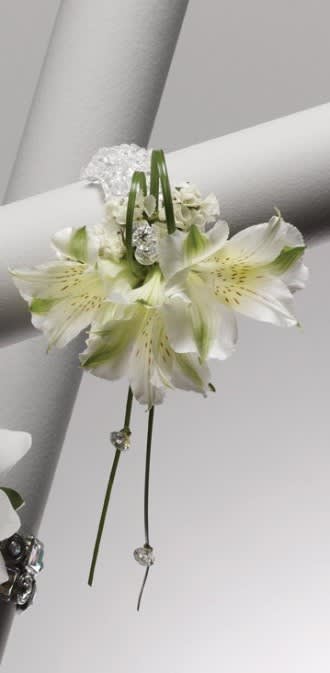 White alstroemeria corsage with crystal accents on a white ribbon