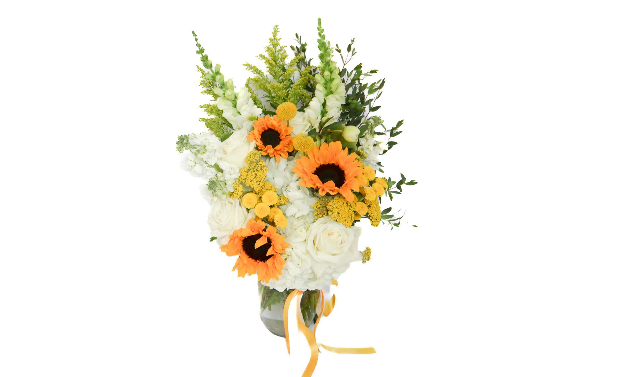Bouquet of white flowers with orange sunflowers in a glass vase