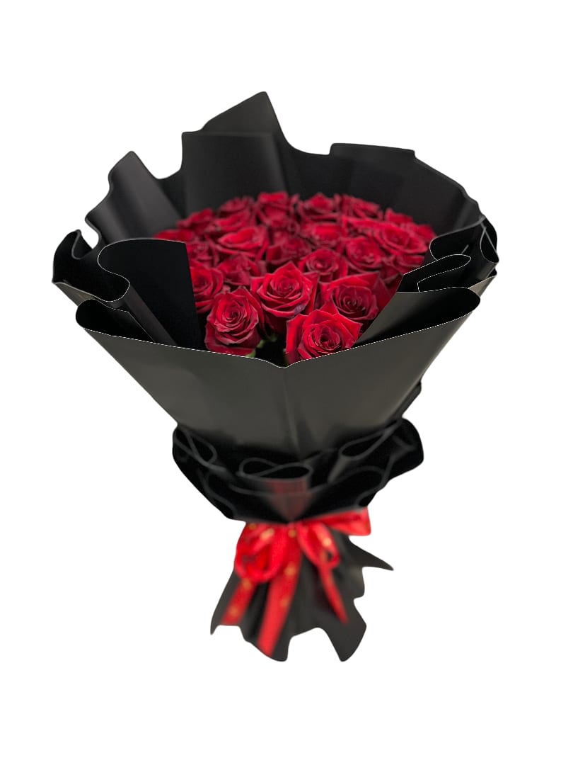 Bouquet of red roses wrapped in black paper with a red ribbon