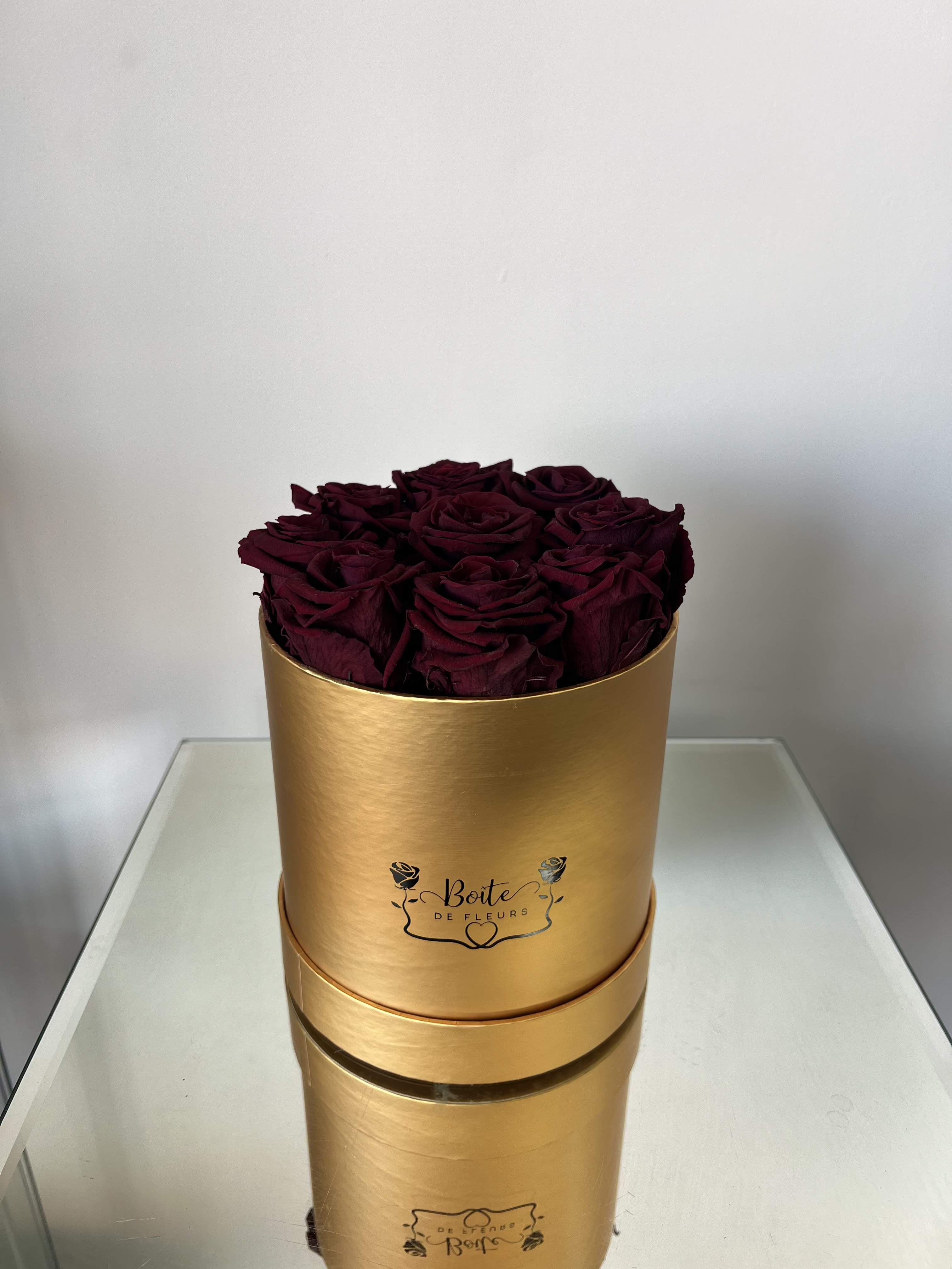 Forever Love (Burgundy) - Make a bold and unforgettable statement with our Eternal Burgundy Luxury Boîte, featuring premium long-lasting preserved burgundy roses beautifully arranged in our signature gold Boîte de Fleurs box. This arrangement is the perfect gift for anniversaries, Valentine’s Day, birthdays, proposals, or just because.  Each preserved rose is carefully selected and treated to maintain its natural beauty for months (even years) with proper care — no water required. These real roses maintain their soft texture and rich burgundy color, offering a modern alternative to traditional fresh flower arrangements.  Boîte de Fleurs specializes in luxury boxed flower arrangements in Phoenix, Scottsdale, and Paradise Valley. We offer premium flower delivery throughout the Phoenix metro area with beautifully packaged, statement-making designs.  Limited quantities available. Order your preserved red rose arrangement today for local Phoenix flower delivery.