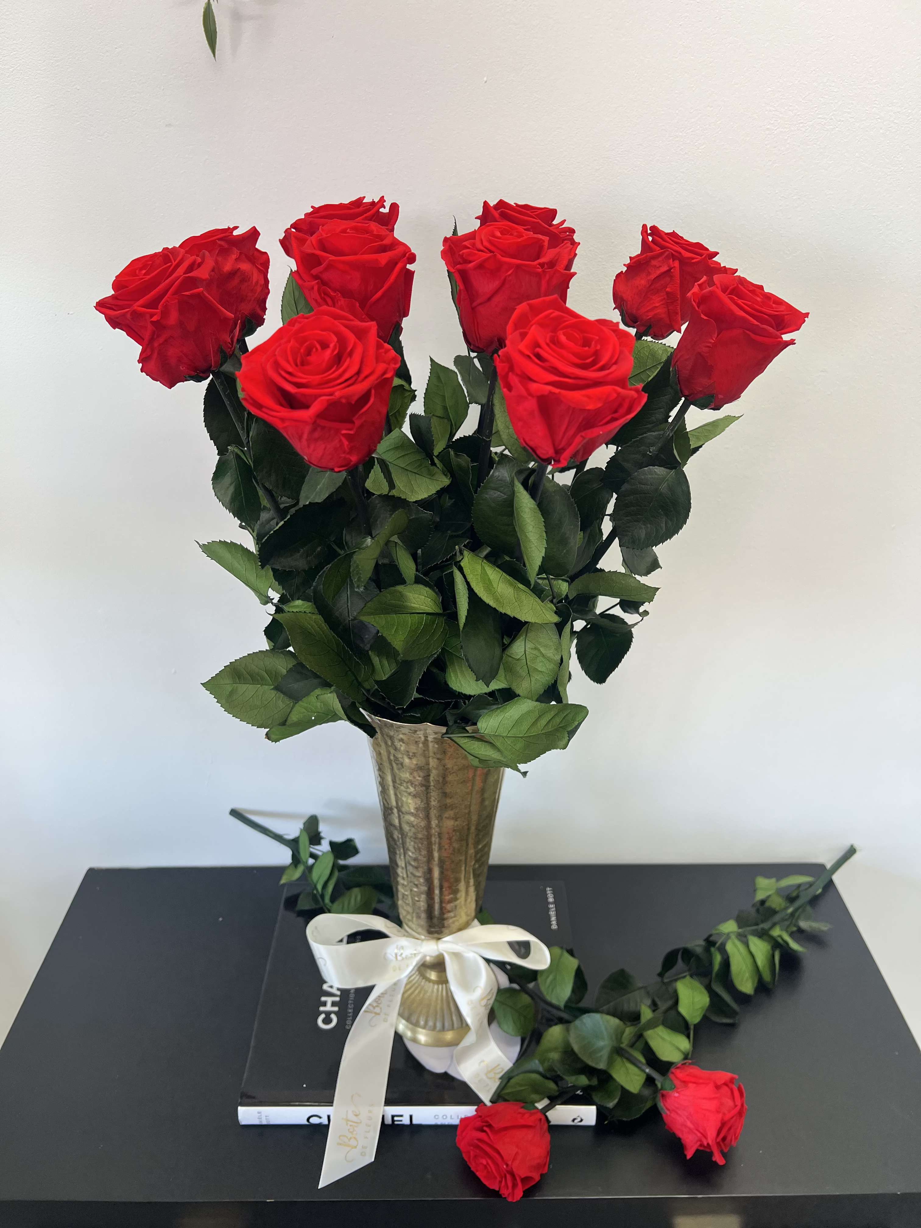 Luxury Love - Elevate your space with our Luxury Love featuring a dozen preserved red roses, elegantly arranged in a gleaming gold vase. This stunning, maintenance-free floral arrangement with forever roses offers lasting beauty for years, making it the perfect timeless gift or sophisticated centerpiece for any home or office.