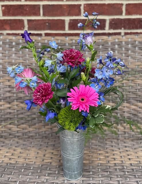 Market Bouquet - A casual mix of seasonal blooms is arranged in a narrow galvanized metal French bucket. Container is 10" tall with a 4"opening. 