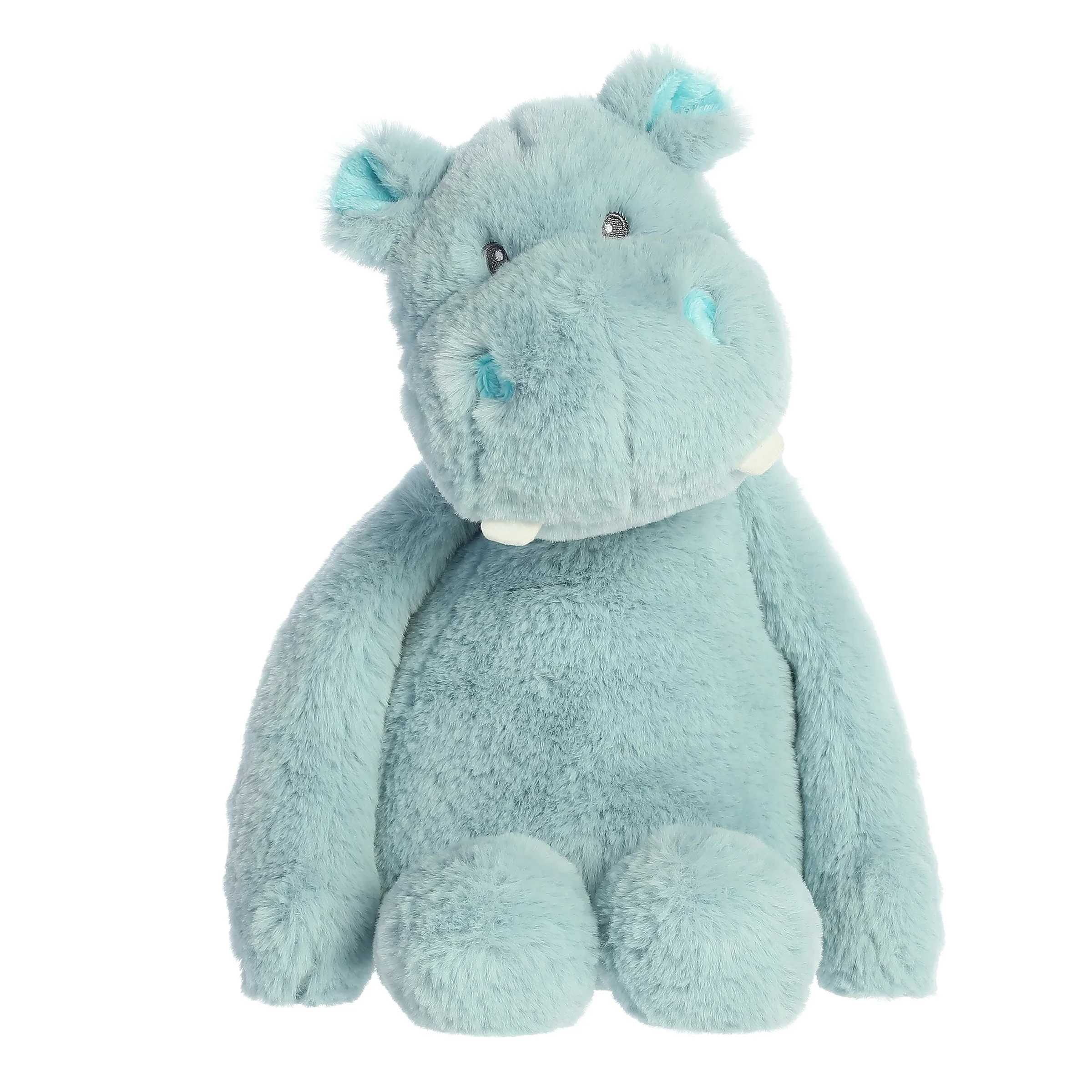 15" Blue Hippo - Hippo from the Hugeez collection by ebba features a playful design with long arms and a plush torso, perfect for sitting up, lying down, or cuddling. Its expressive face and floppy limbs make it a delightful companion for your little one's adventures and bedtime routines, ensuring hours of cuddly fun and cherished memories.