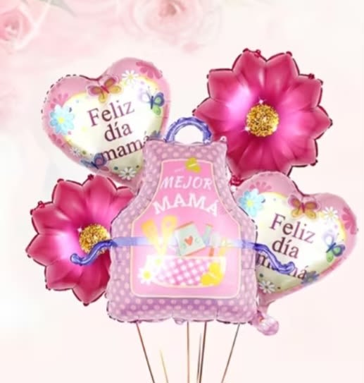 Mejor Mama Mandil Balloon Bouquet - A festive cluster of pink, white and purple foil balloons that announces "MEJOR MAMA" with joyful flair - perfect as a Mother's Day gift or any moment you want to celebrate mom. This balloon bouquet reads like a party in the room: two heart-shaped balloons that say "Feliz día mamá" surround a bold central "MEJOR MAMA" balloon, giving the recipient an immediate, personal message of love.  The bouquet mixes two large flower-shaped foil balloons and a playful gift-bag-shaped balloon on sturdy balloon sticks, arranged for a full, eye-catching display that works on a table, porch, or beside a gift. Colors are bright pinks, soft whites and lavender tones for a cheerful, family-friendly look that suits moms of any age.  Give this to the mom who should feel singled out and celebrated - whether for Mother's Day, a birthday, or just because. Sent ready to place where she'll see it, the foil balloons hold their shape and make a bold, no-fuss statement that complements flowers, cakes, or a wrapped present.