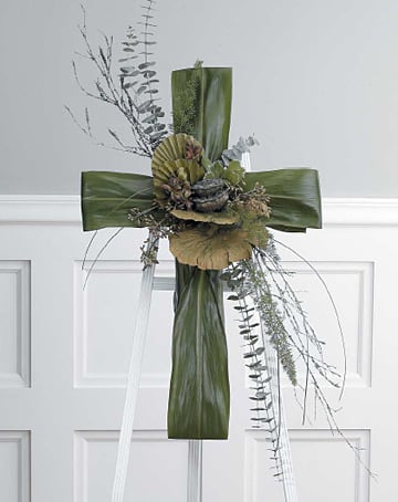 Cherished Cross Foliage Standing Spray - Hignight's Cherished Cross Foliage Standing Spray is a simple and serene way to honor your loved one. Durable fresh foliage accented with long lasting dried pods.  Approximately 36"h x 32"w   Depending on seasonal availabilty, substitutions may be made. Colors, style, and value will remain close to the general style and theme of the original arrangement   For Delivery to the following Funeral Homes, Mortuaries, and Crematories in East Moline and other Quad Cities: Van Hoe Funeral Home, Esterdahl Mortuary &amp; Crematory, Sullivan Ellis Mortuary, Schroder Mortuary, Wheelan Pressly Funeral Home, Rafferty Funeral Home, Trimble Funeral Home, DeRoo Funeral Home, Orr Mortuary, Knox Chapel, Wendt Funeral Home, McGinnis Chambers Funeral Home, Cunnick Collins Funeral Home, Runge Mortuary, Weert Funeral Home.  