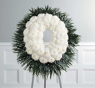 Contemporary Mum Wreath  - Our Contemporary Mum Wreath combines classic white blooms in a timeless wreath to showcase your love, peace and respect.  Depending on seasonal availabilty, substitutions may be made. Colors, style, and value will remain close to the general style and theme of the original arrangement  Approximately 24"   For Delivery to the following Funeral Homes, Mortuaries, and Crematories in East Moline and other Quad Cities: Van Hoe Funeral Home, Esterdahl Mortuary &amp; Crematory, Sullivan Ellis Mortuary, Schroder Mortuary, Wheelan Pressly Funeral Home, Rafferty Funeral Home, Trimble Funeral Home, DeRoo Funeral Home, Orr Mortuary, Knox Chapel, Wendt Funeral Home, McGinnis Chambers Funeral Home, Cunnick Collins Funeral Home, Runge Mortuary, Weert Funeral Home.