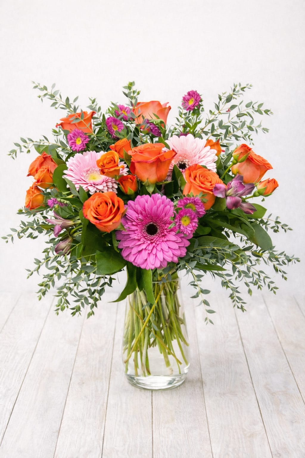 All the Small Things  - All The Small Things is a refined, vibrant mixed flower arrangement in a clear glass vase, hand designed by a local East Moline florist with delivery available.  All The Small Things features a balanced, playful blend of bright seasonal blooms and fresh greenery in a light, modern style, with subtle variations reflecting seasonal availability.  All The Small Things is available for flower delivery in East Moline, Moline, Rock Island, Silvis, Davenport, and Bettendorf, offering a fresh and feel good way to send flowers throughout the Quad Cities.