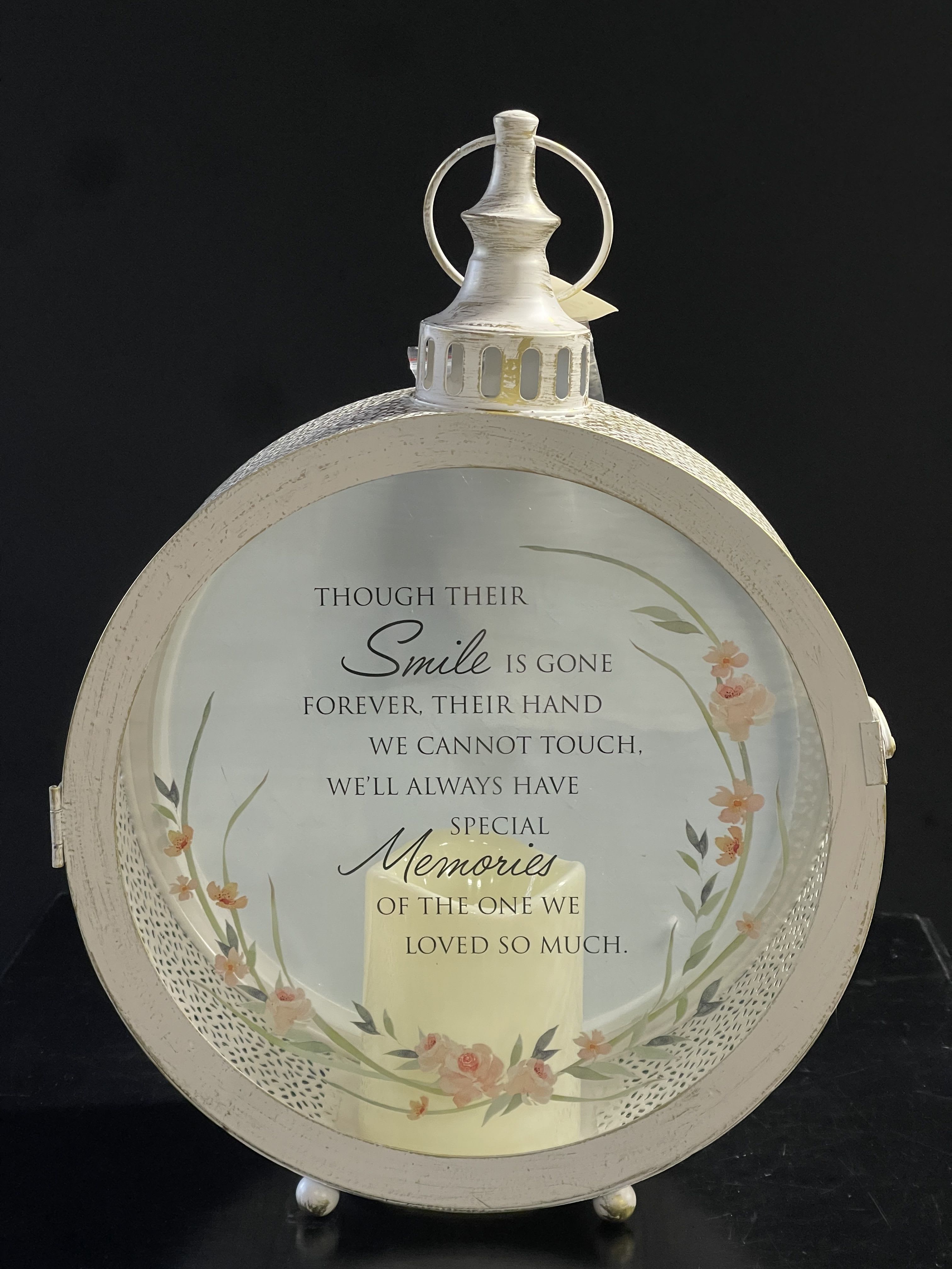 Round memorial lantern with a printed sympathy message and floral accents