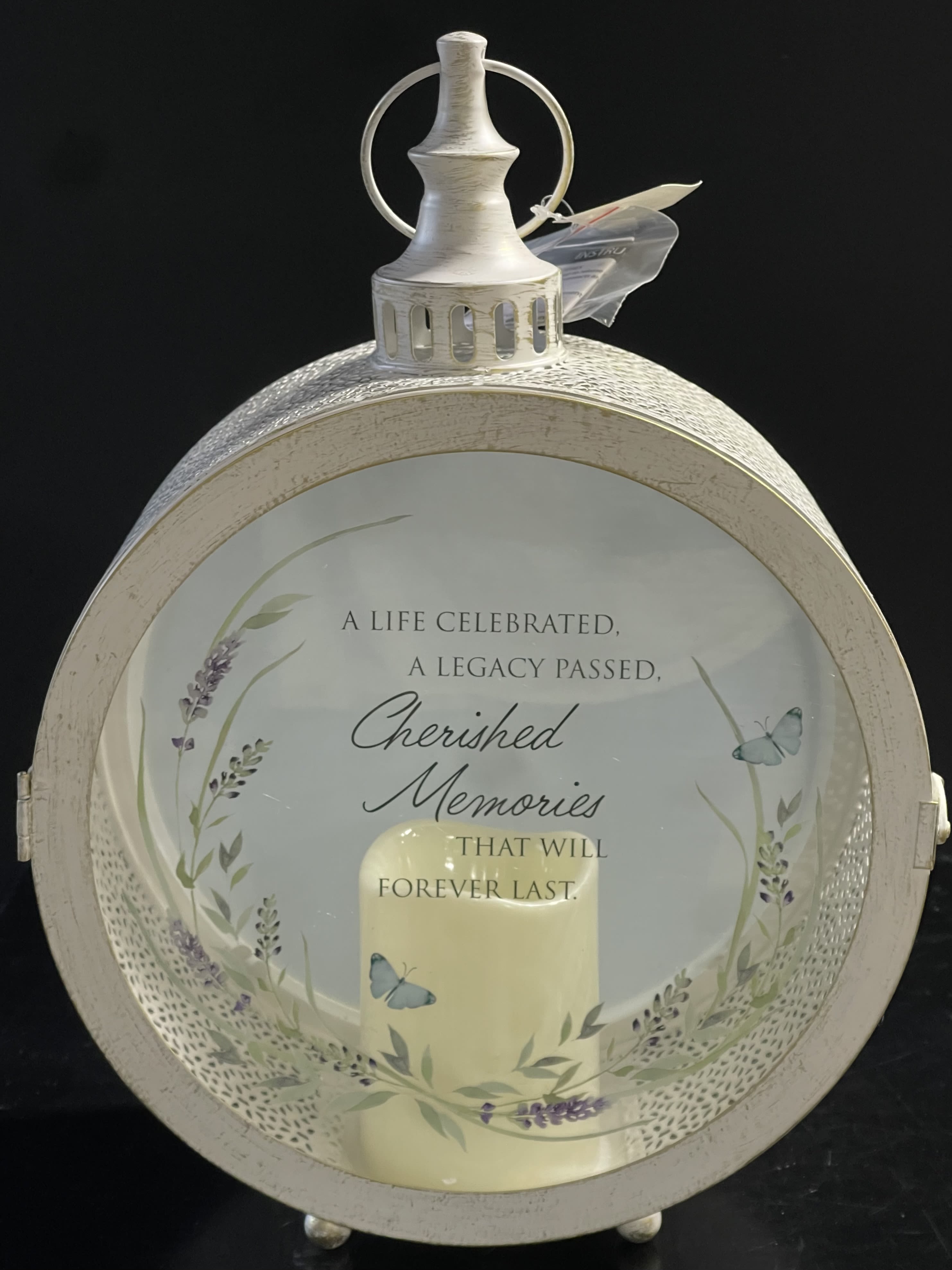 Decorative memorial lantern with a candle and butterfly design