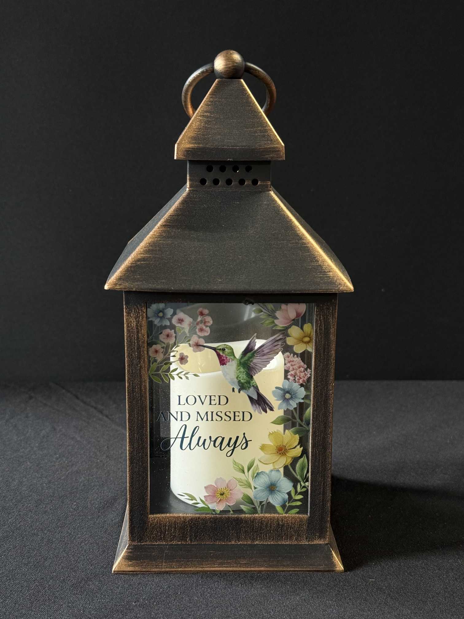Decorative lantern with a memorial candle and floral print