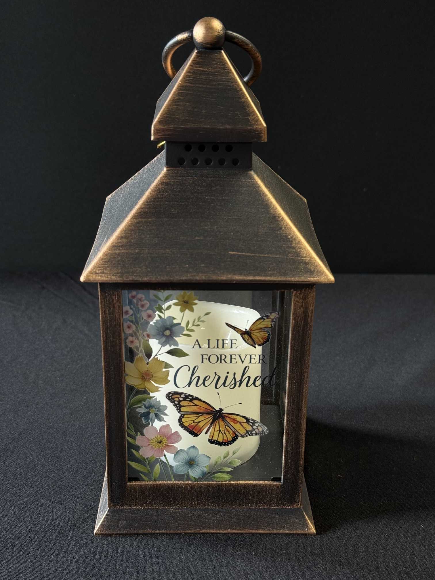 Decorative lantern with a memorial candle and butterfly floral print