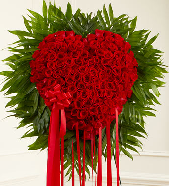 Red Rose Bleeding Heart - When words aren't enough to express the depths of your love, this heart-shaped arrangement makes an unforgettable statement and a stunning tribute. 24 INCH CLOSED HEART. 150 RED ROSES.