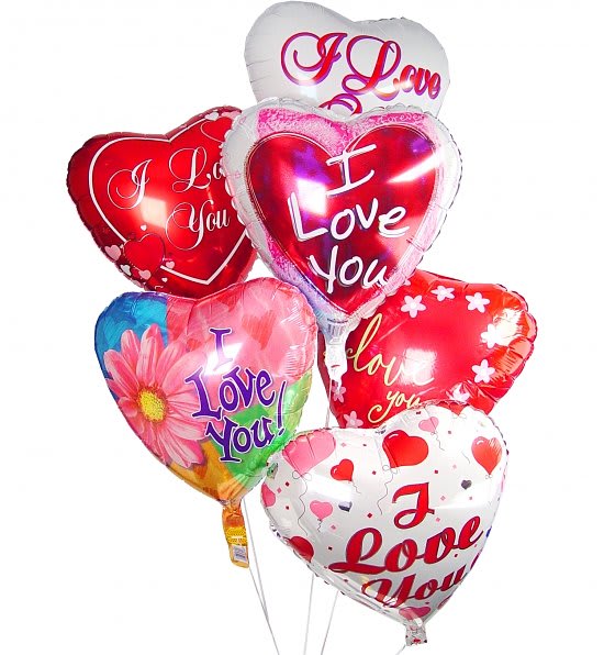 Cluster of heart-shaped foil balloons with I Love You messages in red, pink, and white.