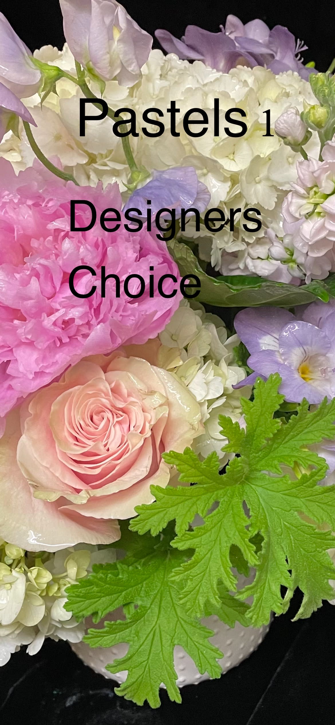 Pastel arrangement of pink peony, blush rose, white hydrangea and greenery in a white vase
