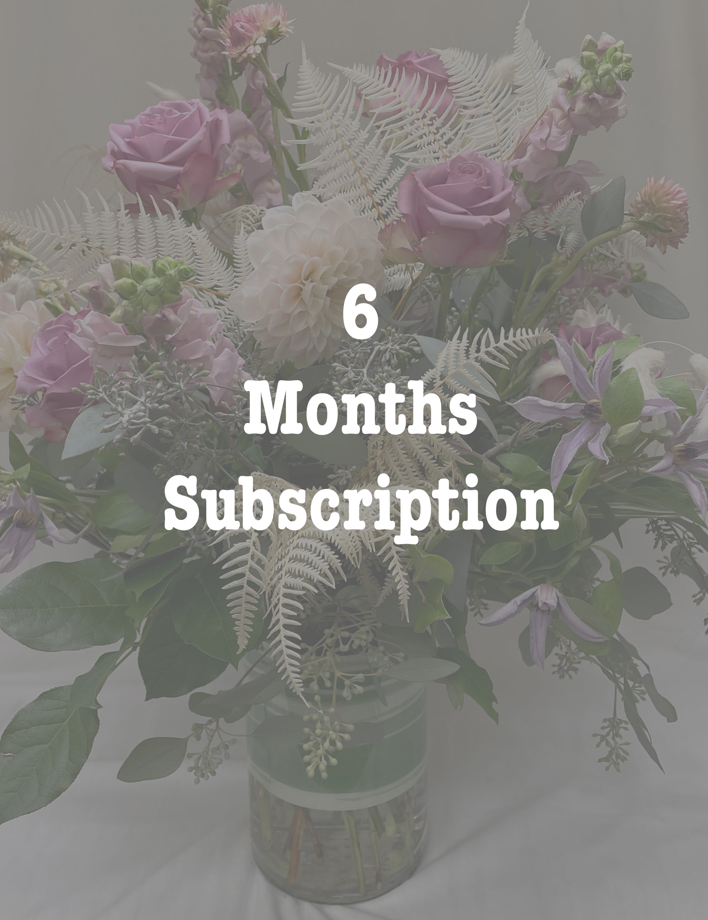 Pastel bouquet of pink roses and white dahlias in a glass vase with six months subscription text overlay