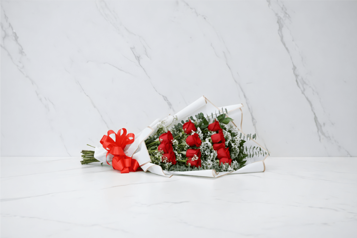 Dozen Red Roses Cascading Bouquet - Red roses(or another color if you wish), wrapped in cascading fashion to give more volume to the bouquet. Elegance in simplicity. Item can be customized if you wish to give us a call at 832 916 3636. Thank you!