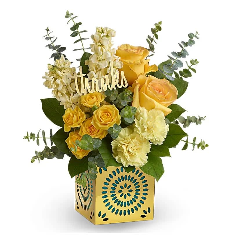 Shimmer Of Thanks Bouquet - Show your appreciation in a most stylish way with this sunny bouquet of yellow roses, stock and carnations! The happy bouquet is hand-delivered in a shimmering golden cube with delicate cutouts. Remove the teal liner and "thanks" and the cube becomes a contemporary candleholder.