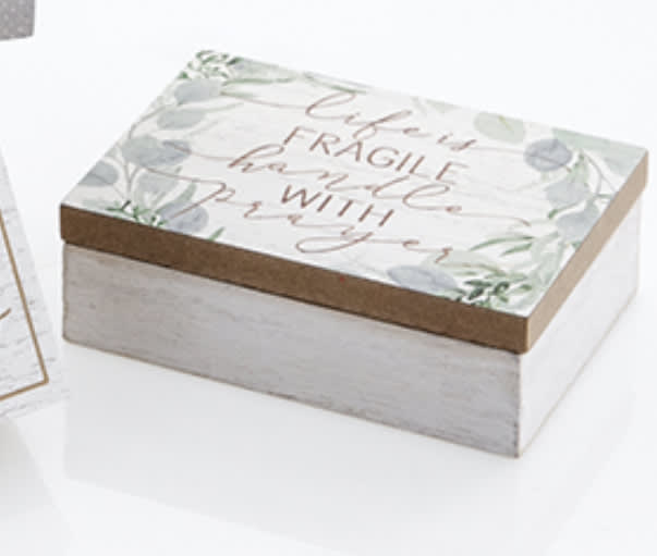 Decorative gift box with a floral lid and cursive text