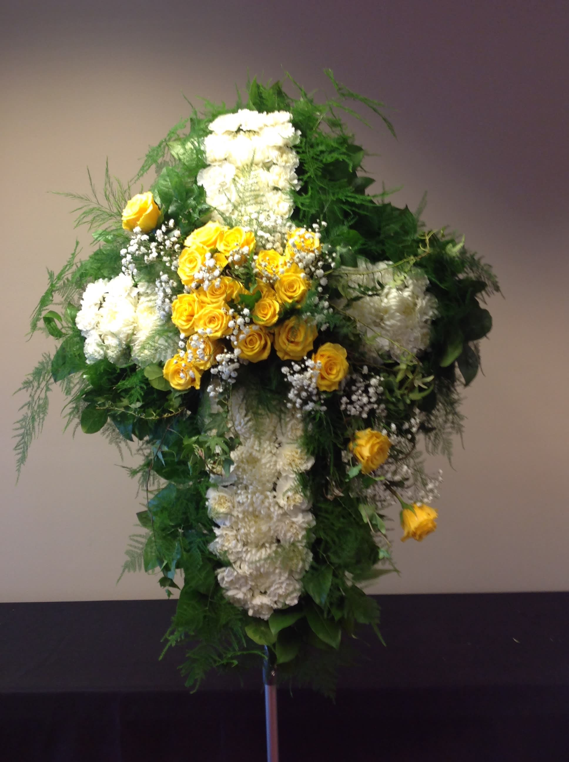 Tall standing floral spray with yellow and white flowers