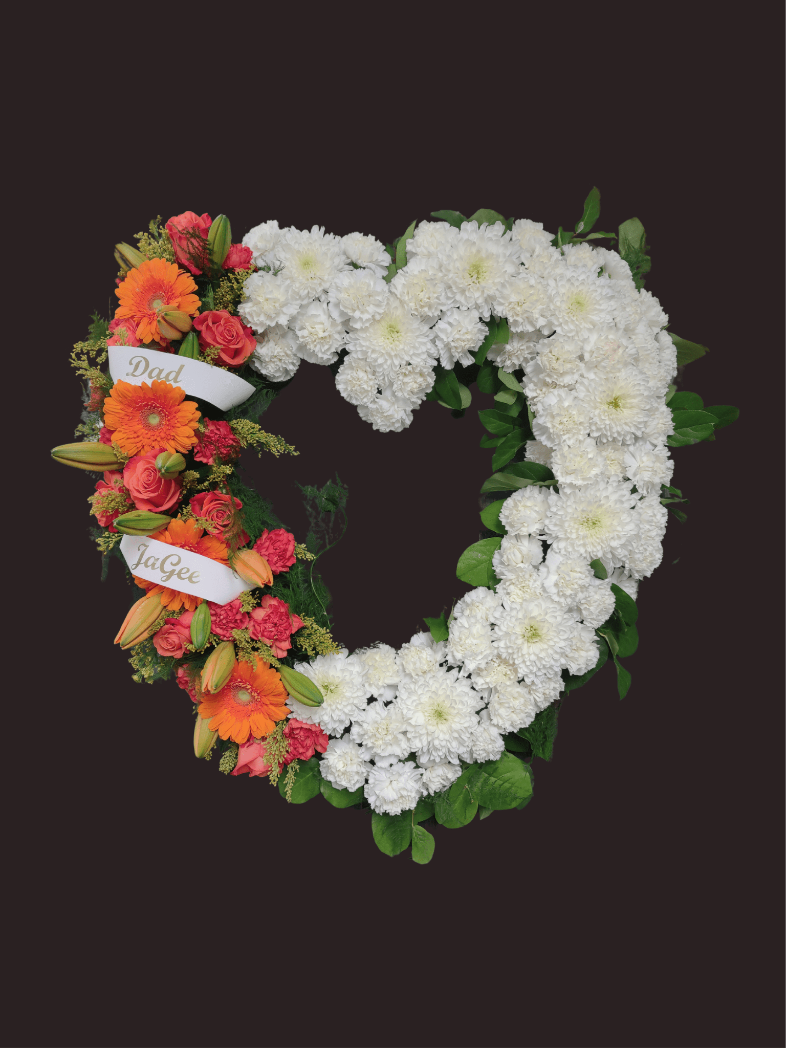 Heart-shaped floral wreath with white and orange flowers and name ribbons