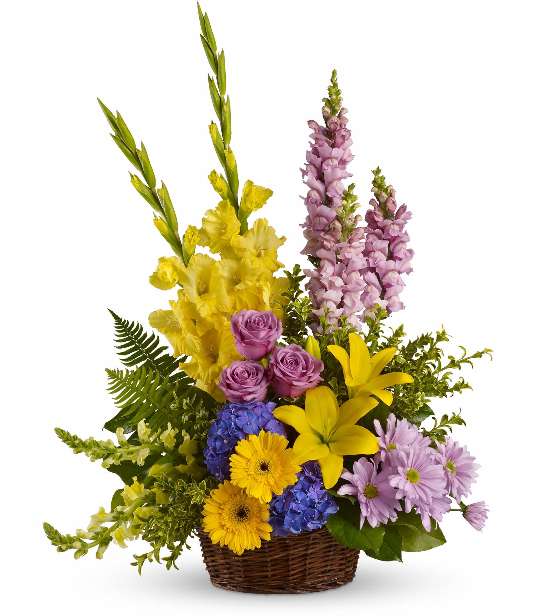 Mixed bouquet in a wicker basket with yellow, purple, and pink flowers