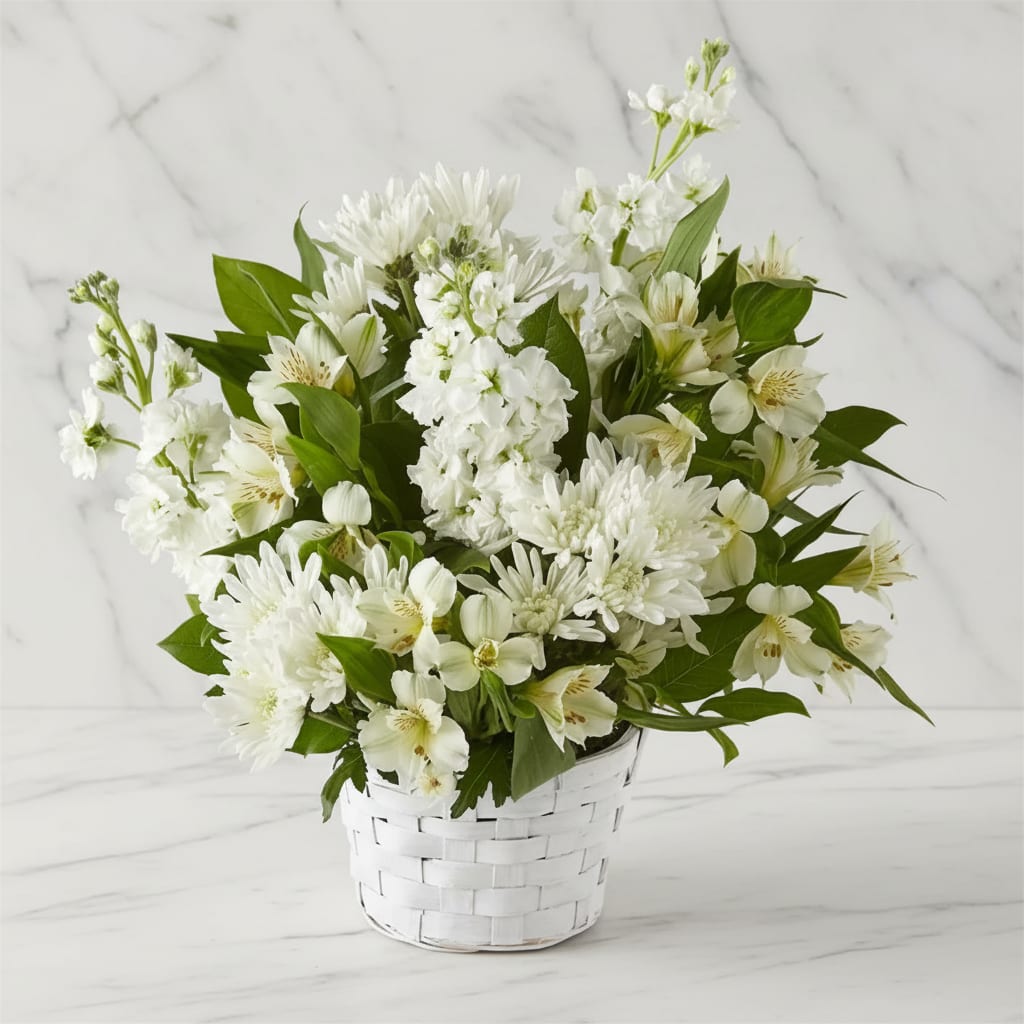 Eternal Affection Basket - Share how much you care with an abundance of elegant white florals. Designed in a basket, Eternal Affection features alstroemeria, roses, poms and more. A fitting gift to send for sympathy, get well or any occasion.