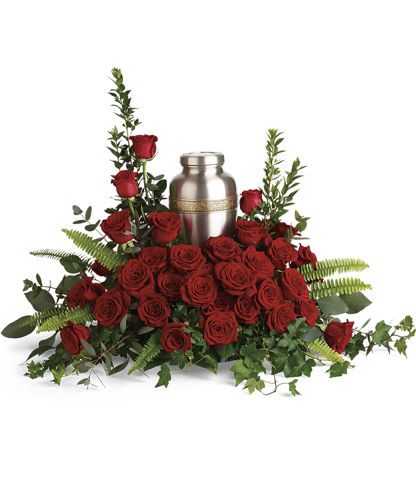 Red roses arranged around a silver urn with greenery