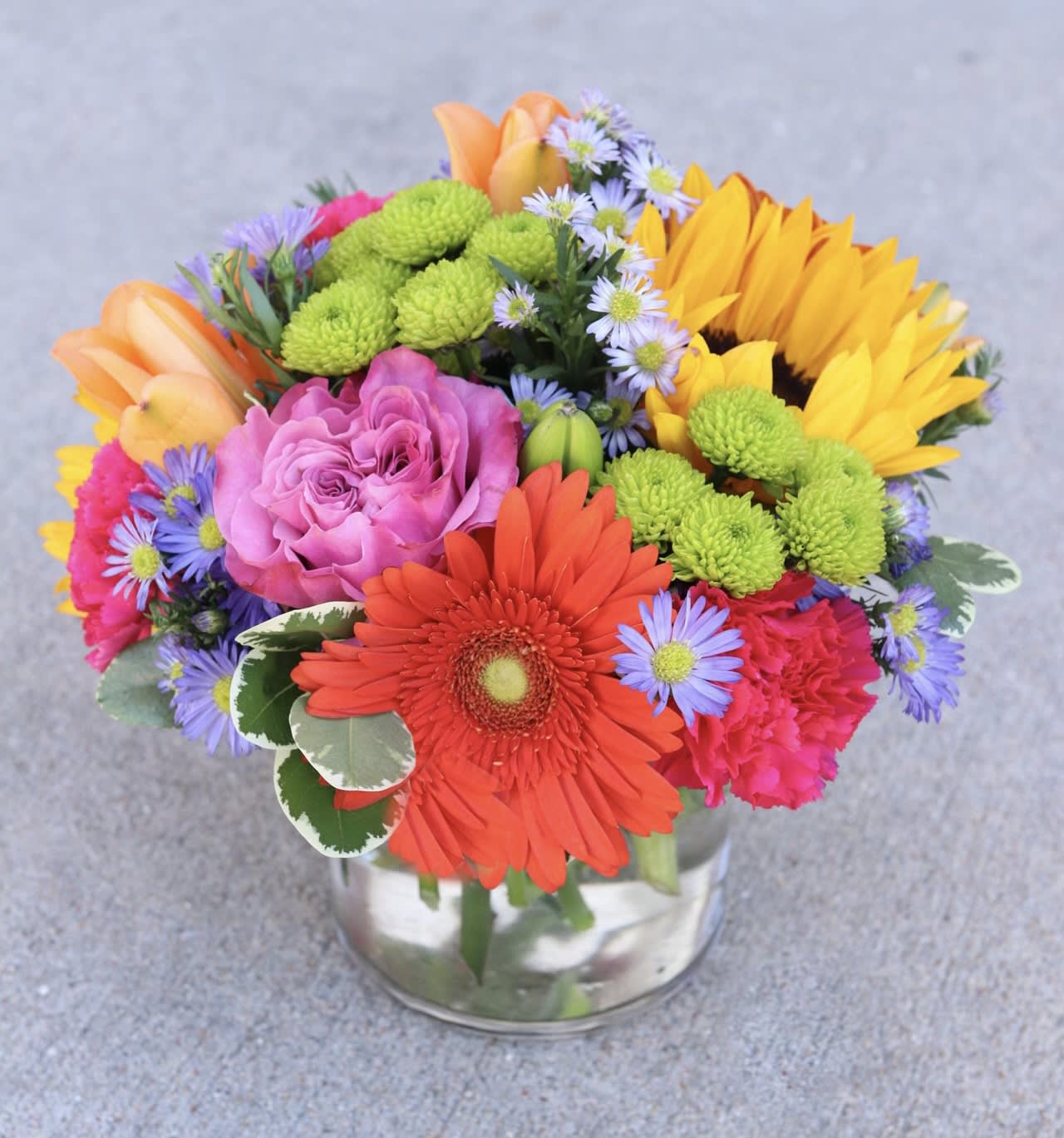 Colorful mixed bouquet in a clear glass vase
